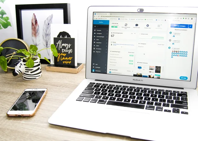 laptop, smartphone, desk, cellphone, mobile phone, digital device, mobile device, technology. CRM mobile use